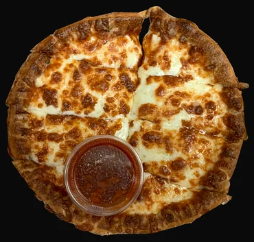 Cheesy bread cut into strips with a cup of dipping sauce